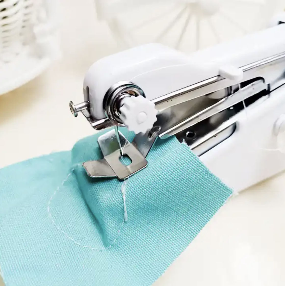 Handheld Portable Stitch Machine 4 Handheld Portable Stitch Machine working on a cloth