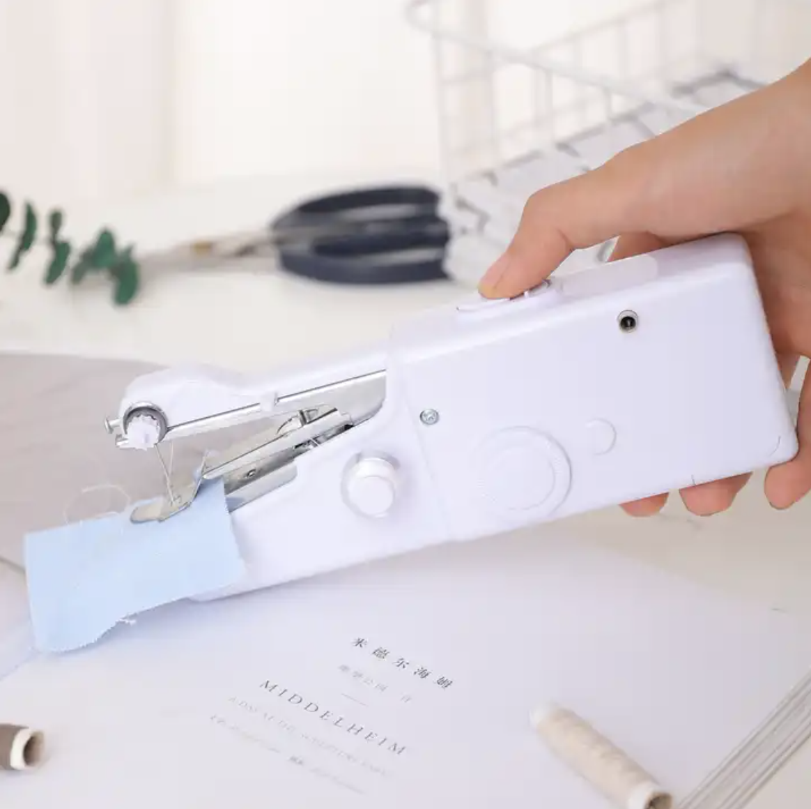 Handheld Portable Stitch Machine stitching a blue clock